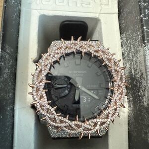 Casio G-Shock Black and Silver Watch with Rose Gold Accents